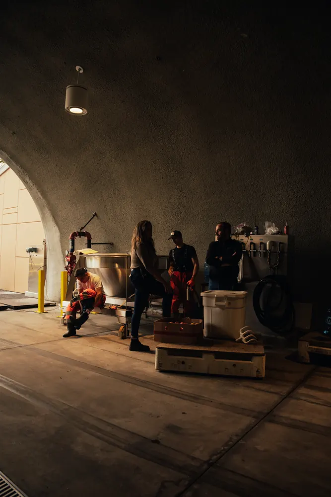 crew working inside a wine cave