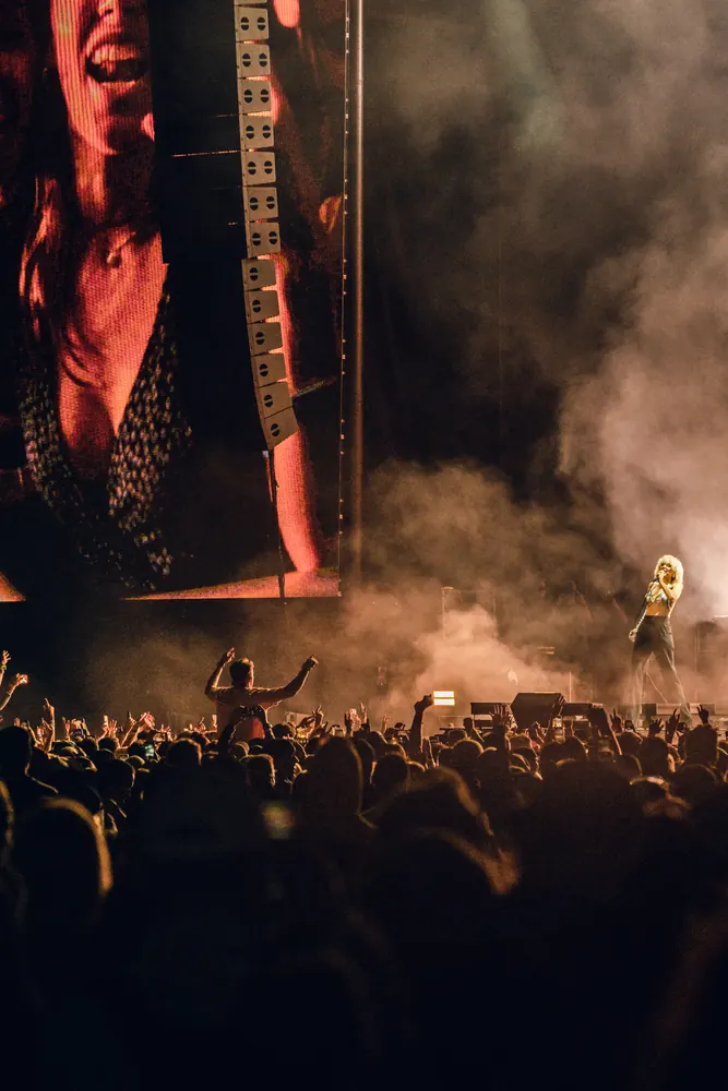 concert crowd under stage lights
