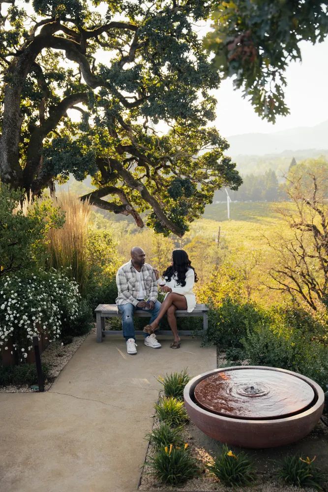 couple in a garden with a fountain